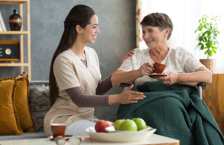 A caregiver and elder sharing a moment